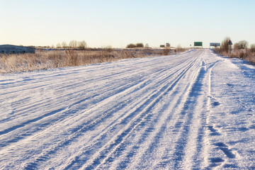 Fototapeta na wymiar winter road landscape sunlight snow