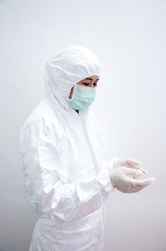 Doctor in protective suite  isolated on a white background
