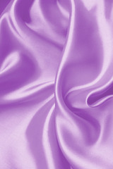 Smooth elegant lilac silk or satin texture as background