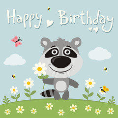 Obraz na płótnie Canvas Happy birthday! Cute raccoon with flower on meadow. Birthday card.
