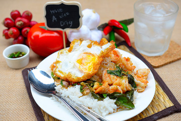 fried shrimps with chilli paste and basils, rice and fried egg topping

