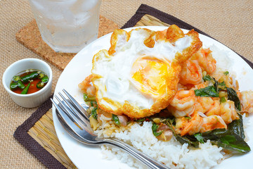 fried shrimps with chilli paste and basils, rice and fried egg topping
