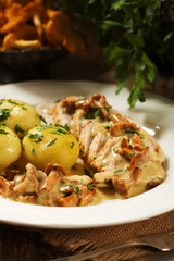 Roasted chicken breast served in a mushroom chanterelle sauce.