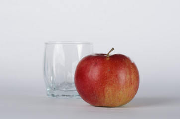 Apple with empty glass 