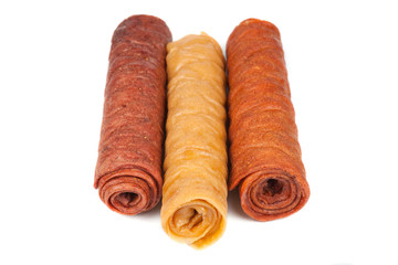 Candied fruit twisted in roll isolated on white background. Homemade sweetness of dried fruit.