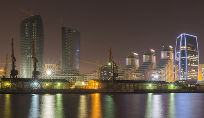 Night view of sea port and business office district of Baku city, capital of Azerbaijan