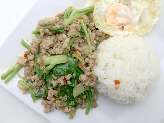 Close up Rice topped with stir fried minced pork and basil, Thai Food.
