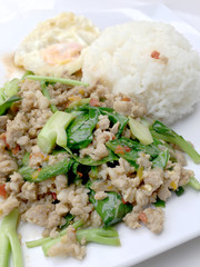 Close up Rice topped with stir fried minced pork and basil, Thai Food.