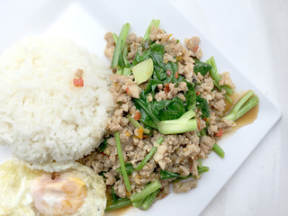 Close up Rice topped with stir fried minced pork and basil, Thai Food.