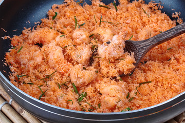 Cooking stir-fried grated coconut with shrimp for served.