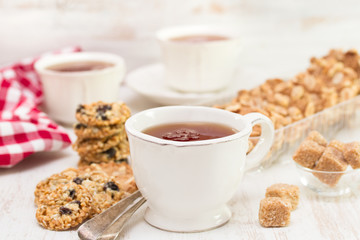 cup of tea with cookies on wooden background