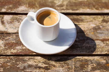 cup of coffee on wooden table