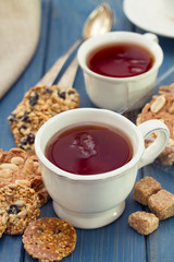 cup of tea with cookies on wooden background