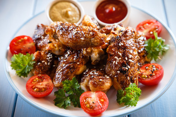 Grilled chicken wings and vegetables