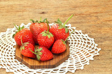 Fresh red strawberries on wooden table