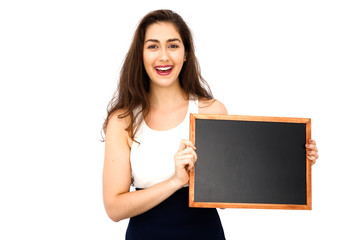 Beautiful Caucasian woman holding empty blackboard over white background - ready to fill text