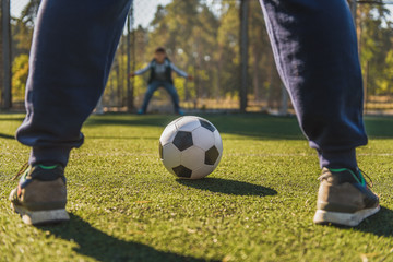 Obraz premium Father playing football with son