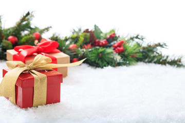Fototapeta na wymiar Gift boxes on snow and white background