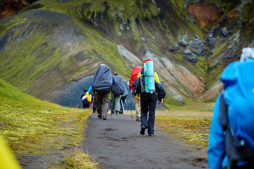 Fototapeta na wymiar hikers with backpacks on the trail in the mountains. Trek in Iceland
