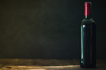 Red wine bottle in traditional cellar