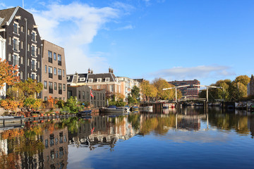 Beautiful view of canals in autumn sunny day,  Amsterdam, Netherlands 
