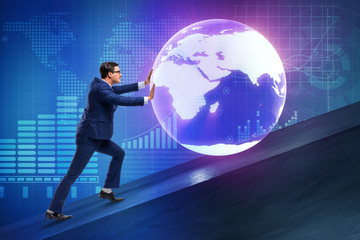 Businessman pushing earth in business concept