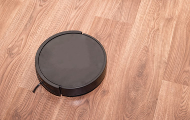 robot cleaner is cleaning the apartment