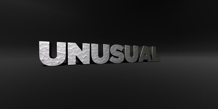UNUSUAL - hammered metal finish text on black studio - 3D rendered royalty free stock photo. This image can be used for an online website banner ad or a print postcard.