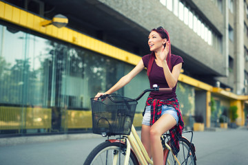 Fototapeta na wymiar .Red hair girl with bike outdoor, city.