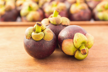 Purple mangosteen - Mangosteens queen of fruits with wooden back