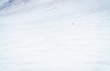 Mountaineers walking on the summit of Mont Blanc