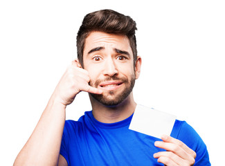 young man holding visit card