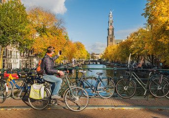 Obraz premium Tourist taking photo of Westerkerk