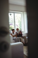 Senior couple using digital tablet