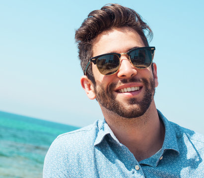 young man smiling in the beach
