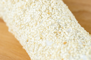 Sushi, california roll with sesame seeds.