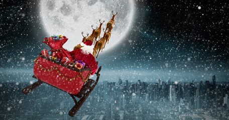 Composite image of high angle view of santa claus riding on sled