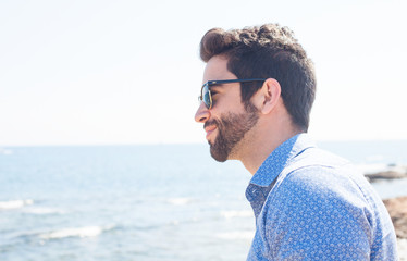 young man smiling in the beach
