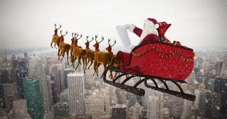 Composite image of santa claus riding on sled during christmas