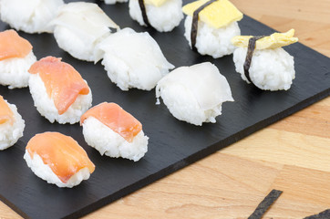 Sushi nigiri set on slate plate.