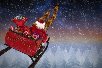 Composite image of high angle view of santa claus riding on sled