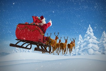 Composite image of santa claus riding on sleigh with gift box