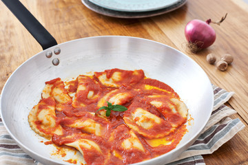 Mezzelune handmade pasta with tomato sauce