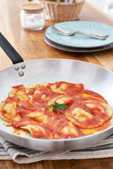 Mezzelune handmade pasta with tomato sauce