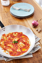 Mezzelune handmade pasta with tomato sauce