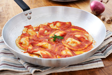 Mezzelune handmade pasta with tomato sauce