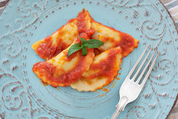 Mezzelune handmade pasta with tomato sauce