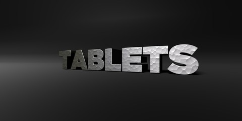 TABLETS - hammered metal finish text on black studio - 3D rendered royalty free stock photo. This image can be used for an online website banner ad or a print postcard.