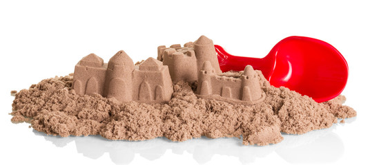 Sand Castles of kinetic  and shovel isolated on white.