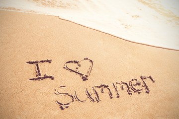 I love summer written on sand